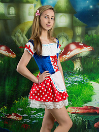 KiloPics presents: Very hot blonde teen beauty in an adorable outfit slowly takes it off to reveal her nice and perky boobs
