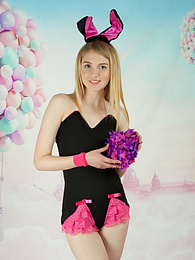 KiloPics presents: This tight blonde bunny has some smoking hot fun with stripping her clothes and playing with her flower